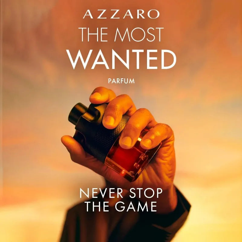 Azzaro The Most Wanted Parfum bottle held in hand, showcasing its bold fragrance and luxury appeal.