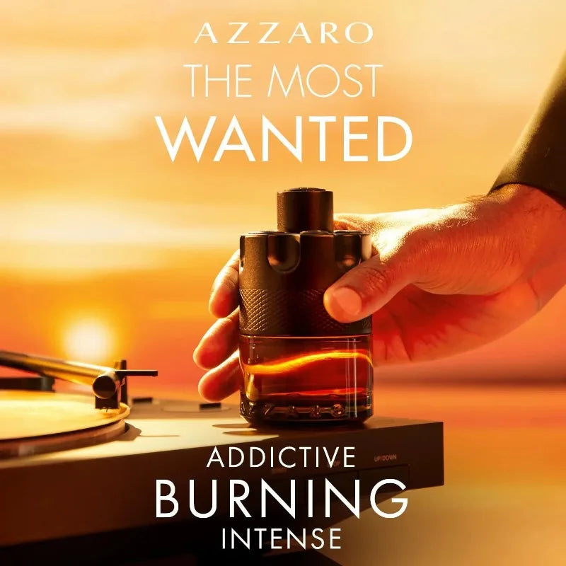 Azzaro The Most Wanted Parfum bottle with sunset background, showcasing intense and addictive fragrance.