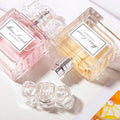 Long-Lasting Perfume for Women bottles in pink and yellow with elegant design.
