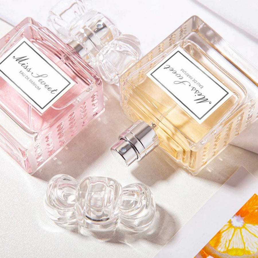 Long-Lasting Perfume for Women bottles in pink and yellow with elegant design.